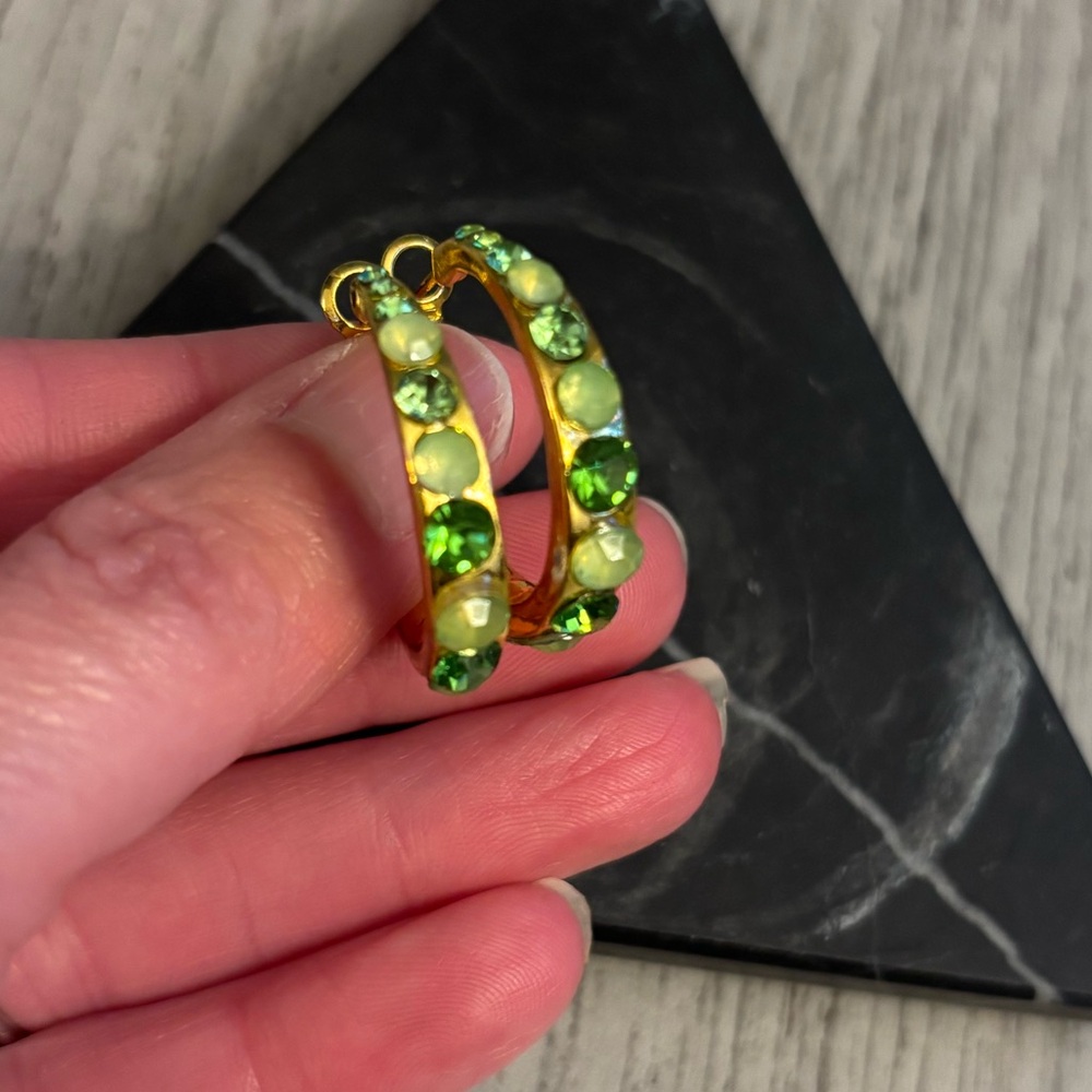 Earrings in gold tone with green stones. EUC.